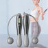 Grey cordless skipping rope with digital smart screen for fitness and weight loss