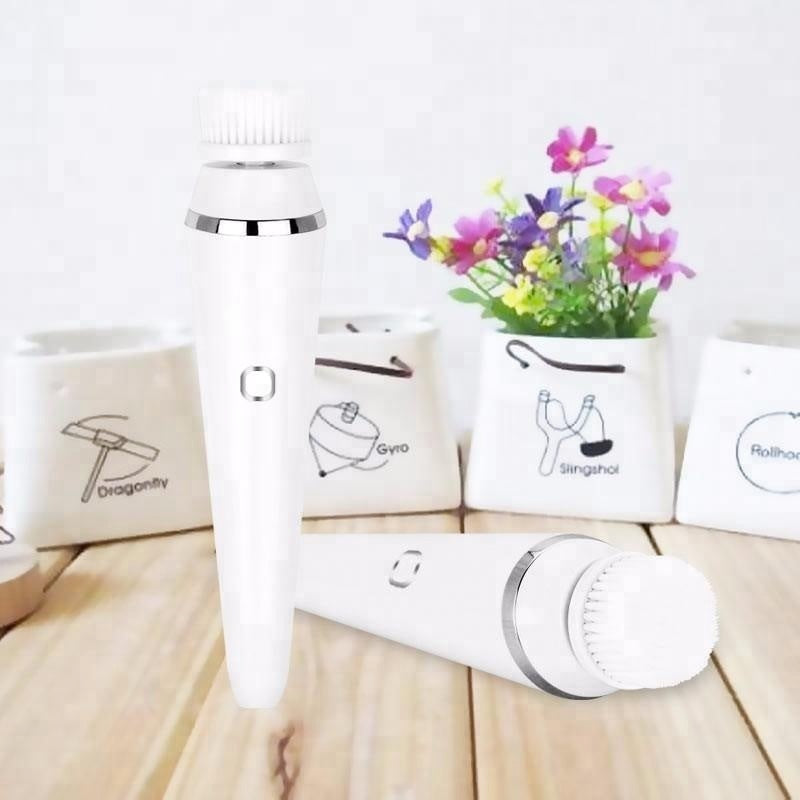Electric cleansing brush with three interchangeable heads and waterproof design for deep facial cleaning and massage